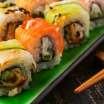 Sushi set: sushi roll with salmon and sushi roll with smoked eel, selective focus.